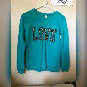 Blue sweater with “love” on it. (Worn once)